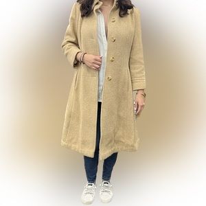 Long tan coat. Very flattering with skirt-like bottom. In very good shape.